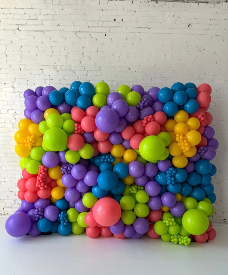 Colorful balloon wall installation by Lady With The Balloons in Leawood, Kansas — perfect for event backdrops, branding, or photo areas.
